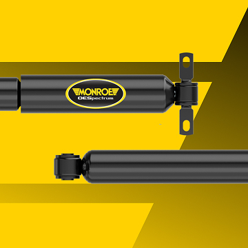 Monroe OESpectrum shock and strut on a yellow background