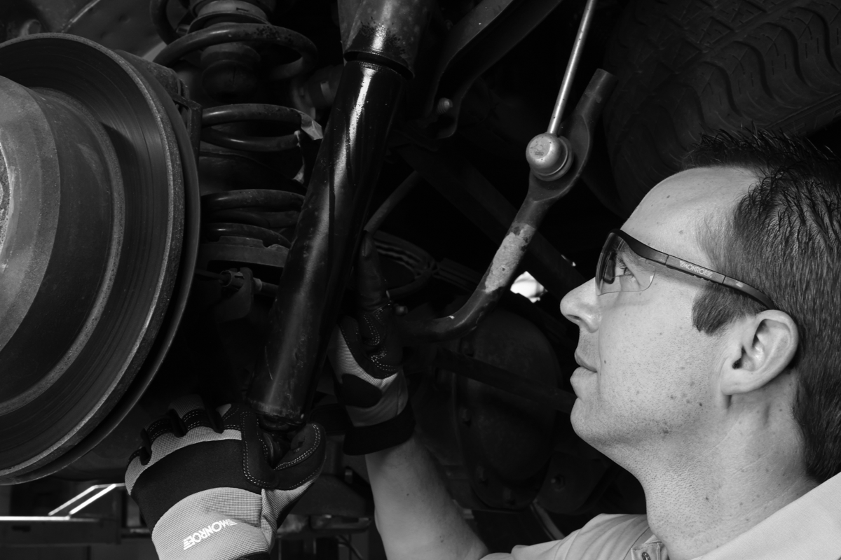 Technician Working on Suspension