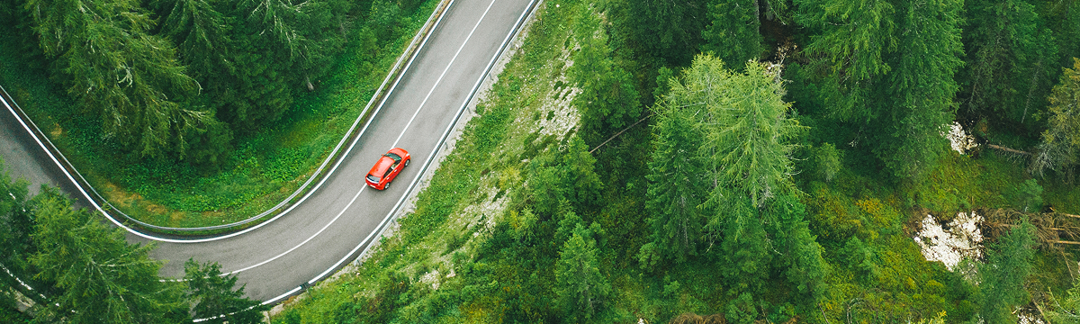 Sedan driving in a curvy road