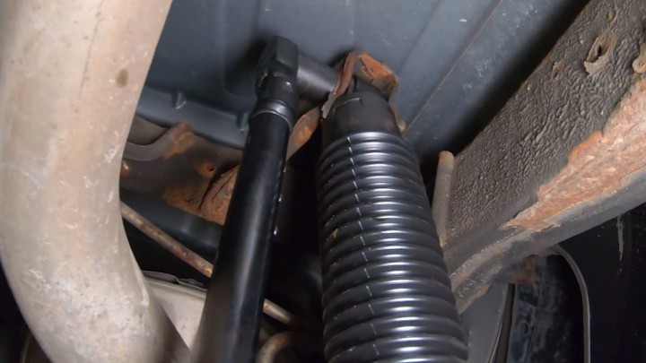 auto-technician-torquing-nuts-on-shock-after-installation-step-10 Auto technician torquing nuts on shock after installation.