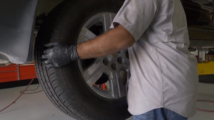 Removing tire from vehicle